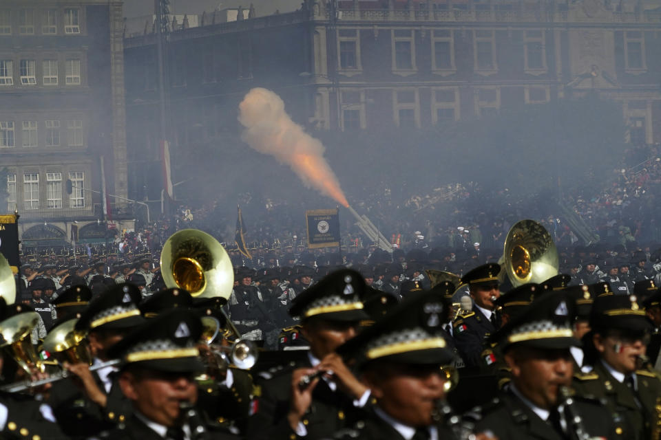 Soldiers fire ceremonial rounds from cannons as part of the annual Independence Day military parade at the main square, the Zocalo, in Mexico City, Friday, Sept. 16, 2022. The event has only been cancelled twice. Most recently during the COVID-19 pandemic in 2020-2021 and during the Mexican-American War when U.S. troops occupied Mexico City in 1847. (AP Photo/Marco Ugarte)