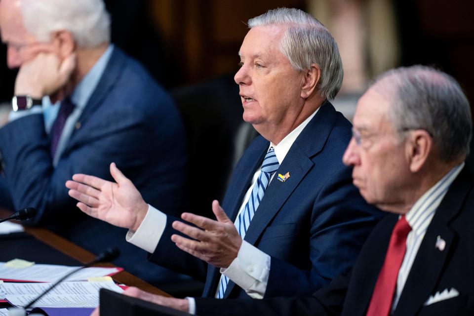 Sen. Lindsey Graham, R-S.C., questions Supreme Court nominee Ketanji Brown Jackson during her confirmation hearing before the Senate Judiciary Committee, Tuesday, March 22, 2022, in Washington. At left is Sen. John Cornyn, R-Texas, and Sen. Chuck Grassley, R-Iowa, right. (AP Photo/Evan Vucci) ORG XMIT: DCEV114