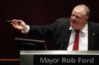 Toronto Mayor Rob Ford speaks during a special council meeting to reduce many of his powers Monday in Toronto.