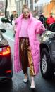 <p>Gigi just beat her record for craziest outfit in a Pepto pink sweater, metallic printed pants, and a sleeping bag with arms. I aspire to be this level of extra. </p>