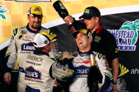 Jimmie Johnson, driver of the #48 Lowe's Chevrolet, celebrates with teammates after clinching the NASCAR Nextel Cup Series Championship following the Ford 400 at Homestead-Miami Speedway on November 18, 2007 in Homestead, Florida. (Photo by Jason Smith/Getty Images for NASCAR)