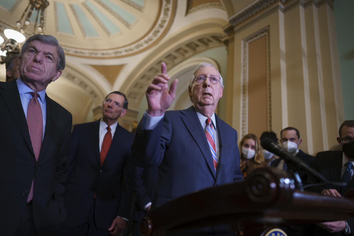 Senate Minority Leader Mitch McConnell, R-Ky., joined from left by Sen. Roy Blunt, R-Mo., and Sen. John Barrasso, R-Wyo., speaks to reporters as work continues on the Democrats' Build Back Better Act, massive legislation that is a cornerstone of President Joe Biden's domestic agenda, at the Capitol in Washington, Tuesday, Sept. 14, 2021. (AP Photo/J. Scott Applewhite)