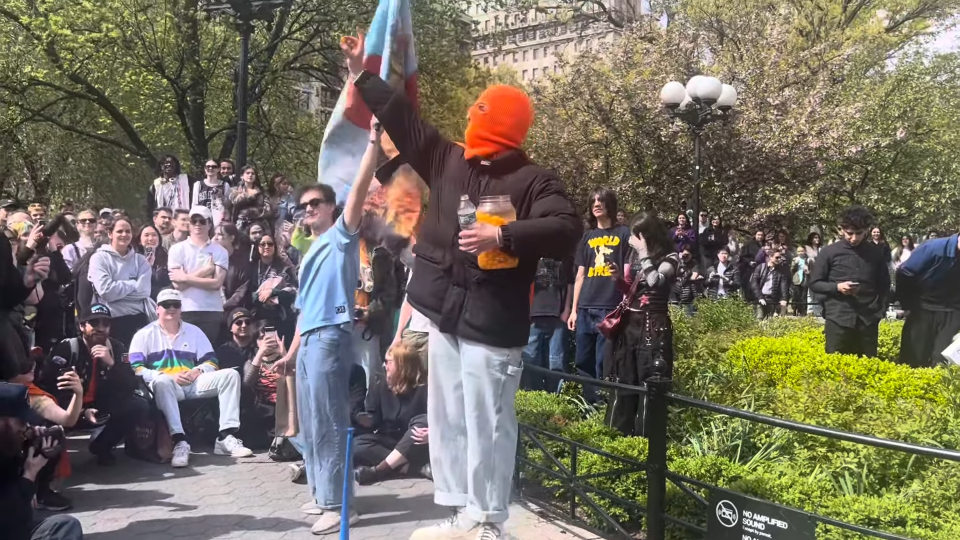 Cheeseballman holding up a cheeseball at event