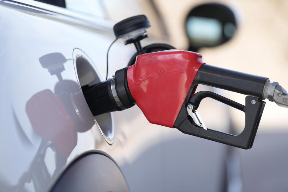 FILE - Fuel is pumped into a vehicle at a Costco gasoline station on Nov. 30, 2023, in Thornton, Colo. On Thursday, Feb. 20, 2024, the Commerce Department issues its January report on consumer spending. (AP Photo/David Zalubowski, File)