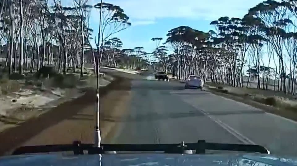 The sedan driver attempts to move back into the second lane but suddenly attempts to veer off the right side of the road instead. Source: Facebook / Dash Cam Owners Australia