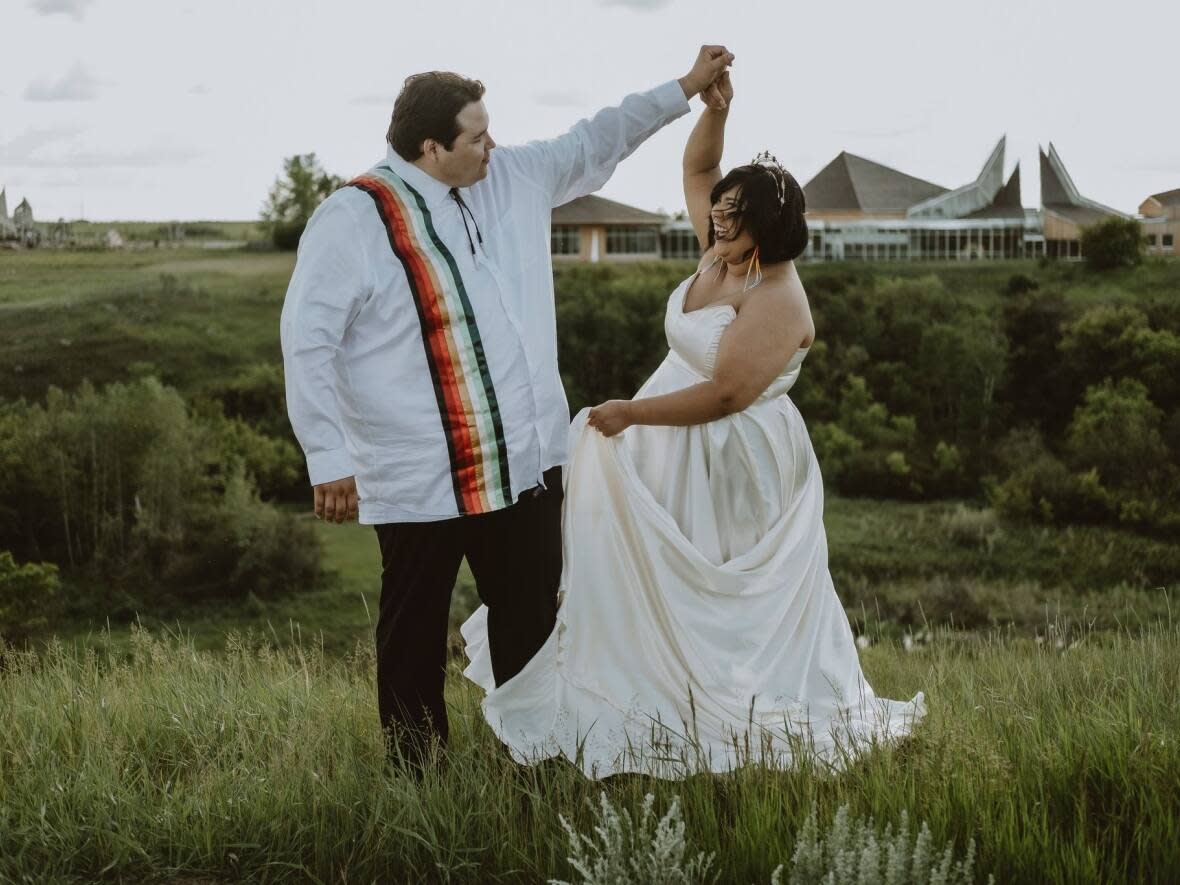 Jordon Inglis and Honey Constant-Inglis on their wedding day, June 16, 2022, at Wanuskewin Heritage Park. (Submitted by Honey Constant-Inglis - image credit)