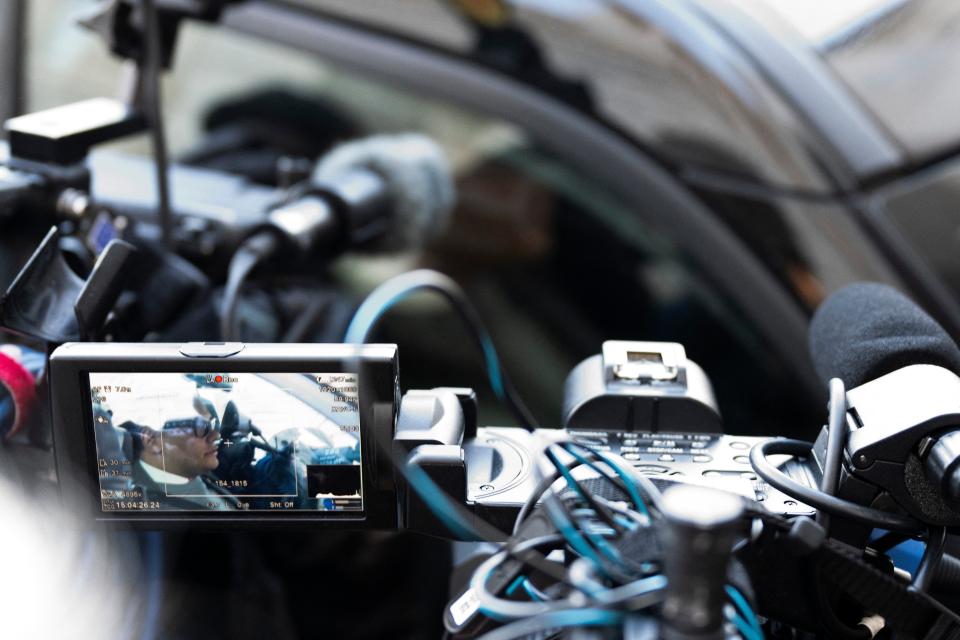 US Representative George Santos (R-NY) is seen on a video camera screen as he sits in his vehicle while departing the US Capitol in Washington, DC, on November 29, 2023 (AFP via Getty Images)