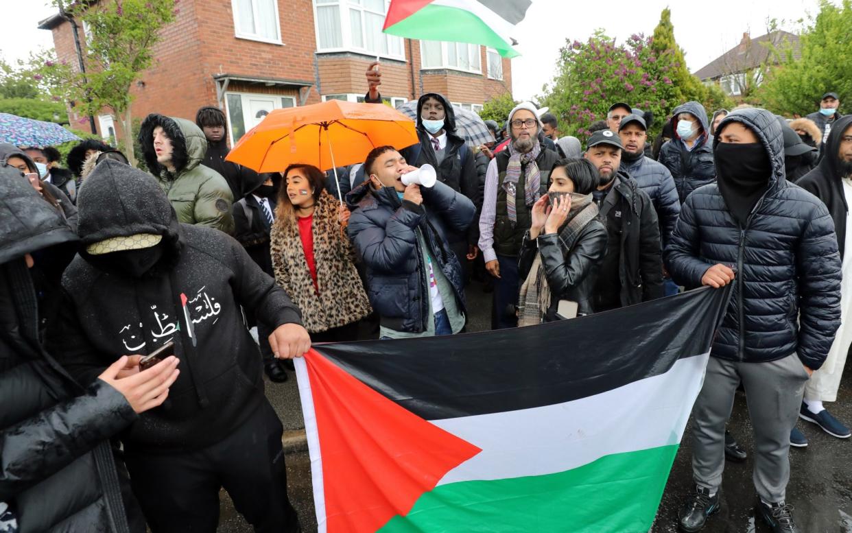 Fea0100354 Free Paliestine Protesters gather at Allerton Grange School in Leeds, West Yorkshire. See story Kevin Donald. A high school headteacher sparked fury when he referred to the Palestinian flag as 