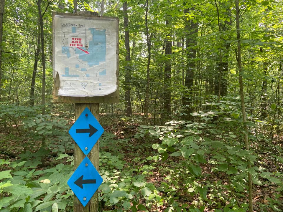 A sign along the trail at the Lick Creek Settlement directs visitors toward the cemetery. It's one of only a few signs in the area.