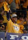 <p>Musician Hank Williams Jr. waves the rally towel before the start of Game 3 of the Stanley Cup Final in Nashville.<br> (Mark Humphrey/AP) </p>