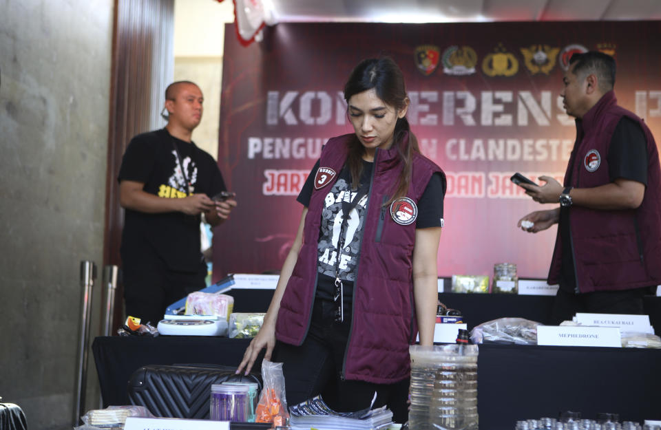 Police officers display evidence during a news conference at a villa in Canggu, Bali, Indonesia on Monday, May 13, 2024. Indonesian police raided what they said was a major drug lab hidden in a villa on the resort island of Bali, and arrested four people. (AP Photo/Firdia Lisnawati)