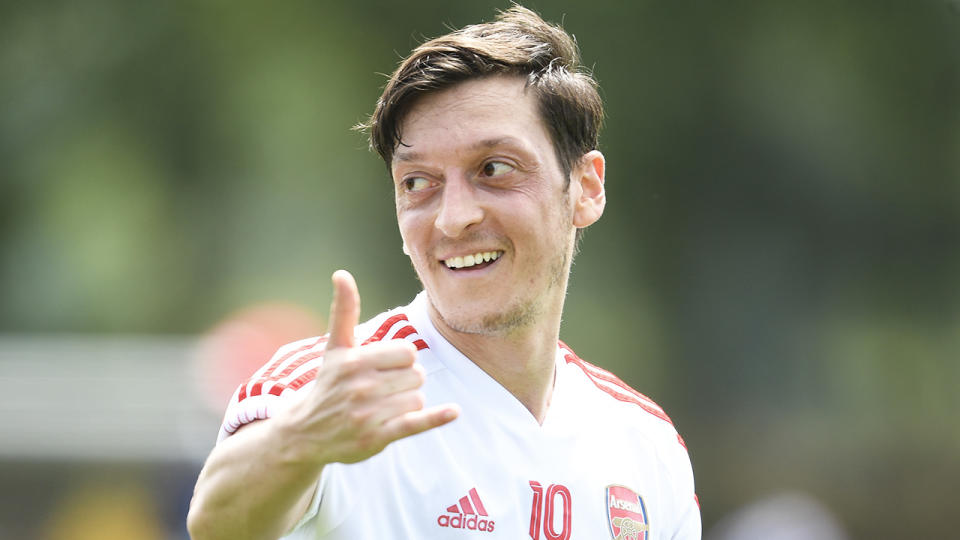 Arsenal's Mesut Ozil celebrating during training.