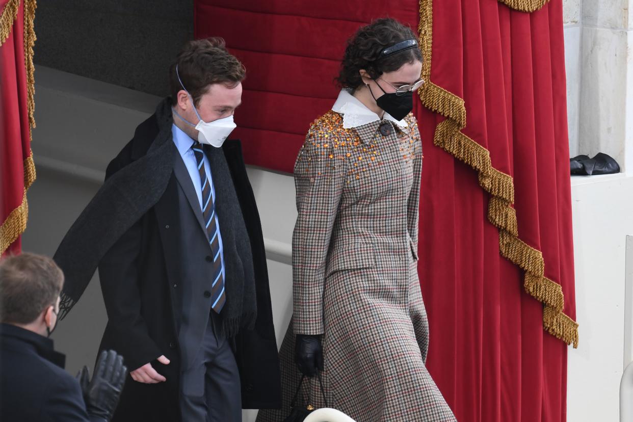 Stepchildren of Vice President-Elect Kamala Harris Cole Emhoff and Ella Emhoff arrive for the inauguration of Joe Biden as the 46th US President on January 20, 2021, at the US Capitol in Washington, DC. (Photo by OLIVIER DOULIERY / AFP) (Photo by OLIVIER DOULIERY/AFP via Getty Images)