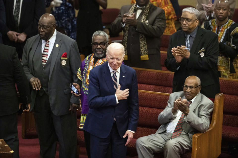 FILE - In this Feb. 23, 2020, file photo, Democratic presidential candidate and former Vice President Joe Biden acknowledges applause from parishioners as he departs after attending services at the Royal Missionary Baptist Church in North Charleston, S.C. As the candidates court devout voters with sharply divergent strategies, the unavoidable nature of presidential politics has left some clergy counseling divided families and others fielding attempts to nudge them left or right. (AP Photo/Matt Rourke, File)