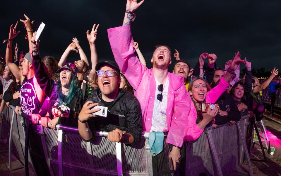 Festivalgoers react during the Enter Shikari performance on the main stage at the pilot for Download - Getty Images Europe