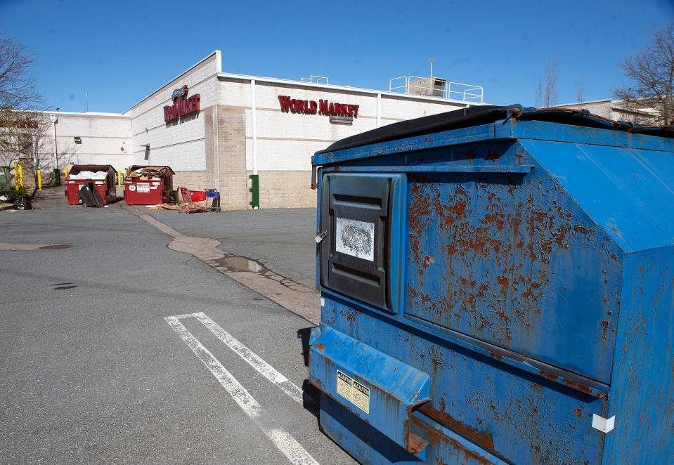 These dumpsters are behind World Market at Shoppers World in Framingham, April 22, 2024. Authorities say a local man was found dead Saturday night behind an unnamed business "in the area of" 1 Worcester Road, which is the address for Shoppers World.