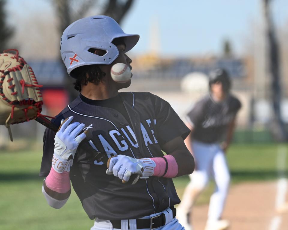 University Prep’s Avery Pope dodges a pitch to walk on bases loaded, allowing a run to give the Jaguars a 5-4 lead during the sixth inning against Hesperia Christian. University Prep defeated Hesperia Christian 9-4 in Cross Valley League play.