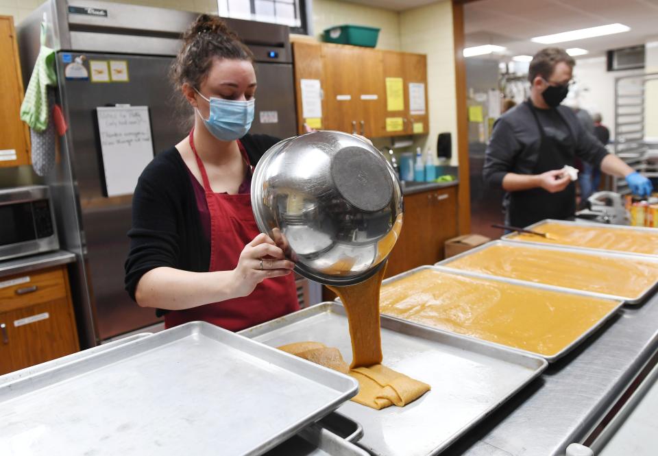 Food at First volunteer Brittany Cabados prepares Thanksgiving meals at First Christian Church Monday, Nov 22, 2021, in Ames, Iowa
