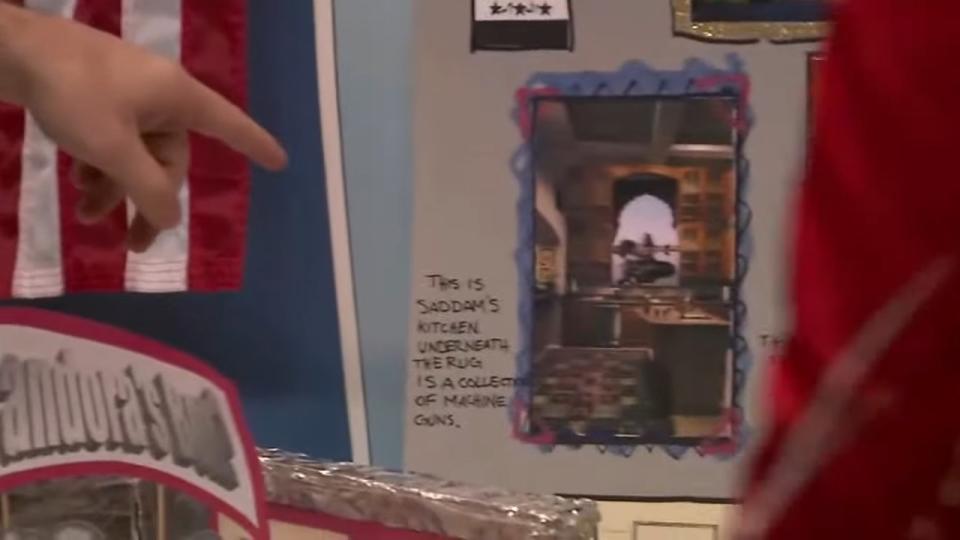 Michael pointing at a picture of Saddam Hussein's kitchen in "Arrested Development"