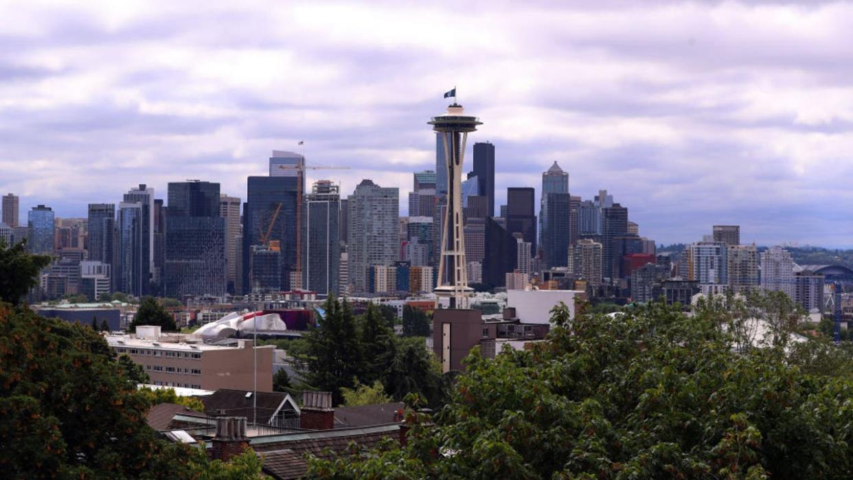 <div>A general view of the Seattle skyline as the Seattle Kraken team flag is hung from the Space Needle on July 23, 2020 in Seattle, Washington.</div> <strong>(Photo by Abbie Parr/Getty Images)</strong>