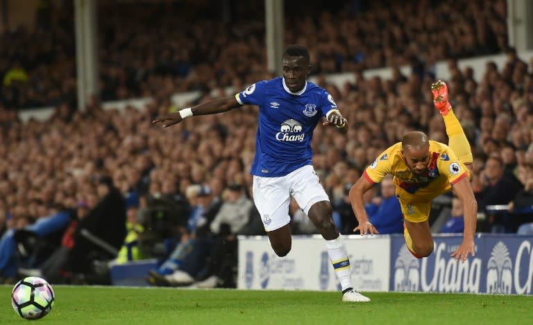 Crystal Palace's English midfielder Andros Townsend (R) goes flying after a chllenge by Everton's Senegalese midfielder Idrissa Gueye during their English Premier League football match in Liverpool, north west England on September 30, 2016