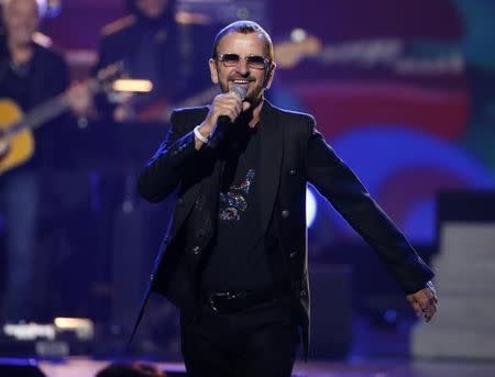 Ringo Starr, drummer for The Beatles, performs during the taping of "The Night That Changed America: A Grammy Salute To The Beatles", which commemorates the 50th anniversary of The Beatles appearance on the Ed Sullivan Show, in Los Angeles January 27, 2014. REUTERS/Mario Anzuoni