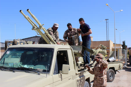 Members of the Libyan internationally recognised government forces prepare ammunition to head out from Misrata to the front line in Tripoli, Misrata, Libya May 9, 2019. REUTERS/Ayman Al-Sahili