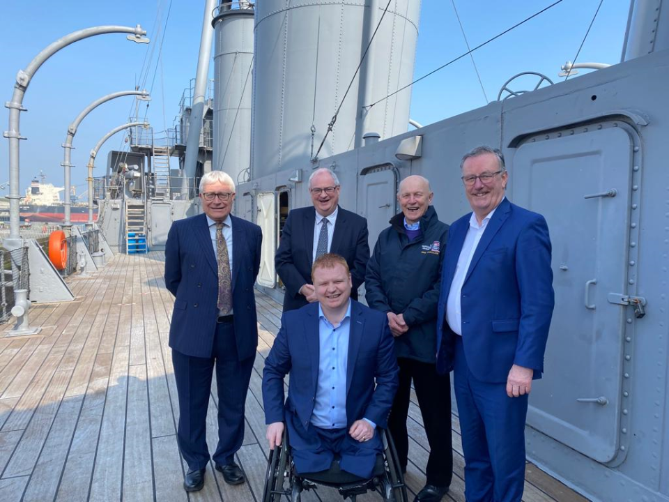 Ulster Unionist MLAs (second from left) Steve Aiken, Mike Nesbitt (right) and Andy Allen (front) have welcomed the securing of the future of HMS Caroline in Belfast. (UUP/PA)