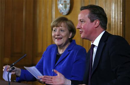 Britain's Prime Minister David Cameron speaks as German Chancellor Angela Merkel smiles during a news conference at Number 10 Downing Street in London February 27, 2014. REUTERS/Andrew Winning