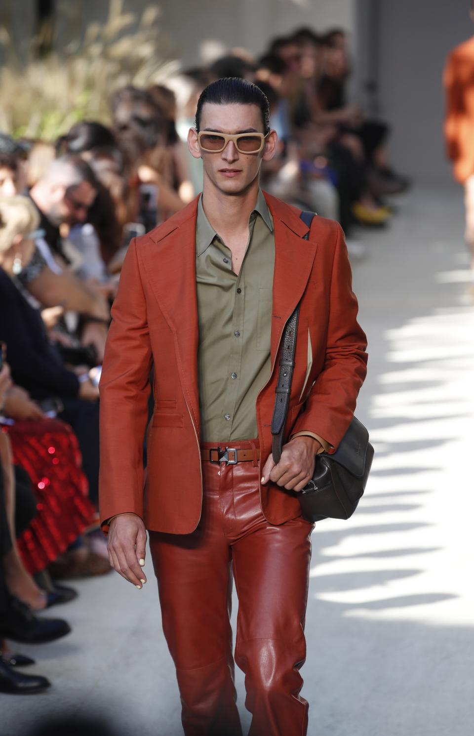 A model wears a creation as part of the Salvatore Ferragamo Spring-Summer 2020 collection, unveiled during the fashion week, in Milan, Italy, Saturday, Sept. 21, 2019. (AP Photo/Antonio Calanni)