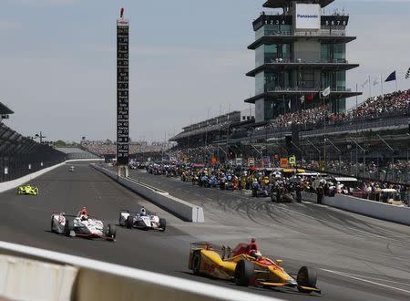 May 27, 2016; Indianapolis, IN, USA; Verizon Indy Car driver Ryan Hunter-Reay leads a pack of cars down the front straightaway during Carb Day for the Indianapolis 500 at Indianapolis Motor Speedway. Mandatory Credit: Brian Spurlock-USA TODAY Sports