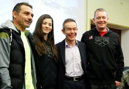 Syrian swimmer Yusra Mardini, her father Izzet (L) Pere Miro (2nd R) Deputy Director General for Relations with the Olympic Movement at the International Olympic Committee (IOC) and coach Sven Spannekrebs (R) of Wasserfreunde Spandau 04 pose after a news conference in Berlin, Germany March 18, 2016. REUTERS/Fabrizio Bensch