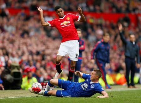 Football Soccer - Manchester United v Everton - Barclays Premier League - Old Trafford - 3/4/16 Manchester United's Marcus Rashford in action with Everton's James McCarthy Action Images via Reuters / Jason Cairnduff Livepic EDITORIAL USE ONLY.