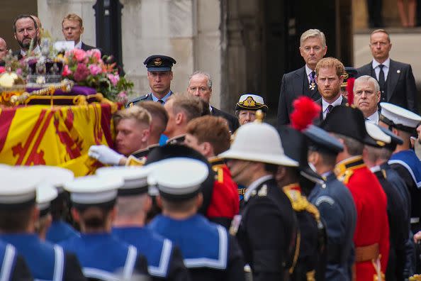 LONDON, ENGLAND - SEPTEMBER 19: Princess Anne, Princess Royal, Prince Andrew and Prince Harry, Duke of Sussex watch as the coffin of Queen Elizabeth II is placed on a gun carriage ahead of the State Funeral of Queen Elizabeth II at Westminster Abbey on September 19, 2022 in London, England. Elizabeth Alexandra Mary Windsor was born in Bruton Street, Mayfair, London on 21 April 1926. She married Prince Philip in 1947 and ascended the throne of the United Kingdom and Commonwealth on 6 February 1952 after the death of her Father, King George VI. Queen Elizabeth II died at Balmoral Castle in Scotland on September 8, 2022, and is succeeded by her eldest son, King Charles III. (Photo by Emilio Morenatti - WPA Pool/Getty Images)