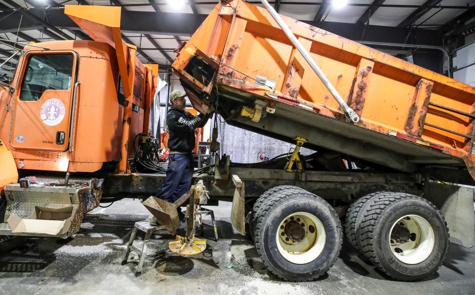 Todd Evans, with Louisville Metro Public Works, services a truck used to spread salt on local roads on December 21, 2022