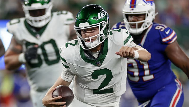 New York Jets quarterback Zach Wilson (2) carries the ball against the Buffalo Bills during the fourth quarter of an NFL football game, Monday, Sept. 11, 2023, in East Rutherford, N.J.