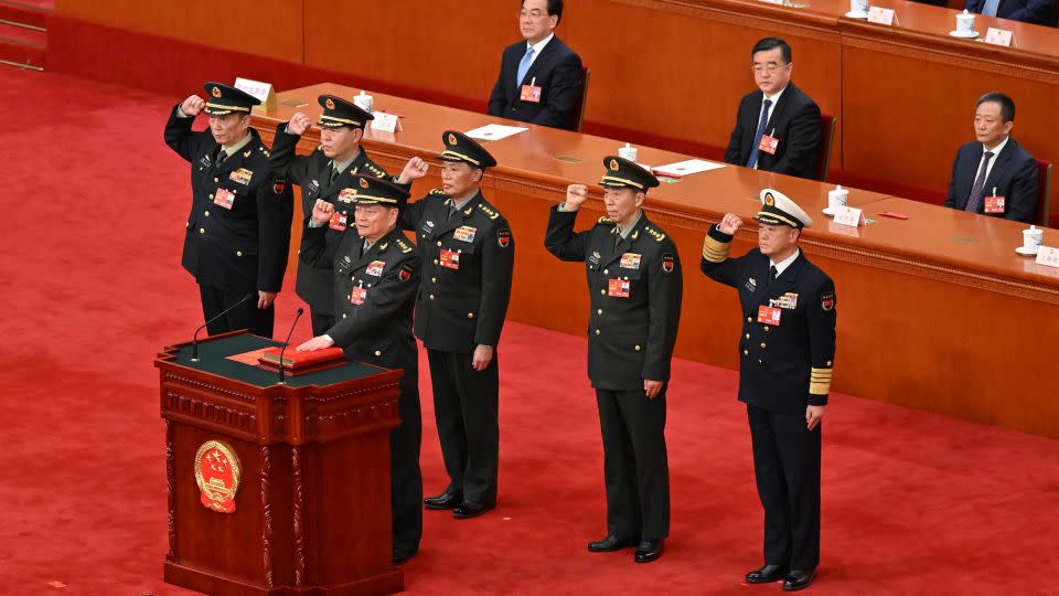 Vice chairmen and members of the Central Military Commissionof pledge allegiance to the Chinese constitution at the Great Hall of the People in Beijing on March 11. - Xinhua News Agency/Getty Images/File