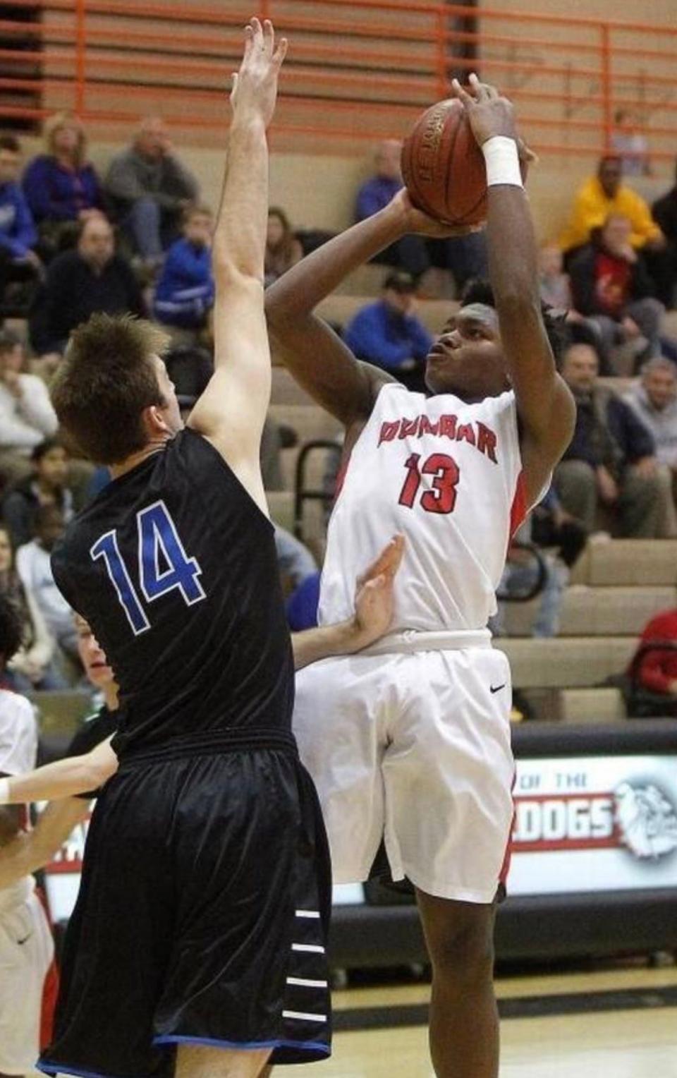 Star Ifeacho takes a shot during a Dunbar High School basketball game.