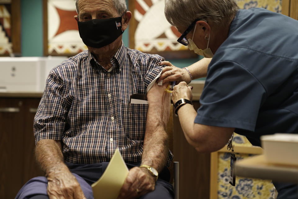 A senior citizen receives the Moderna Inc. Covid-19 vaccine in Arizona. 