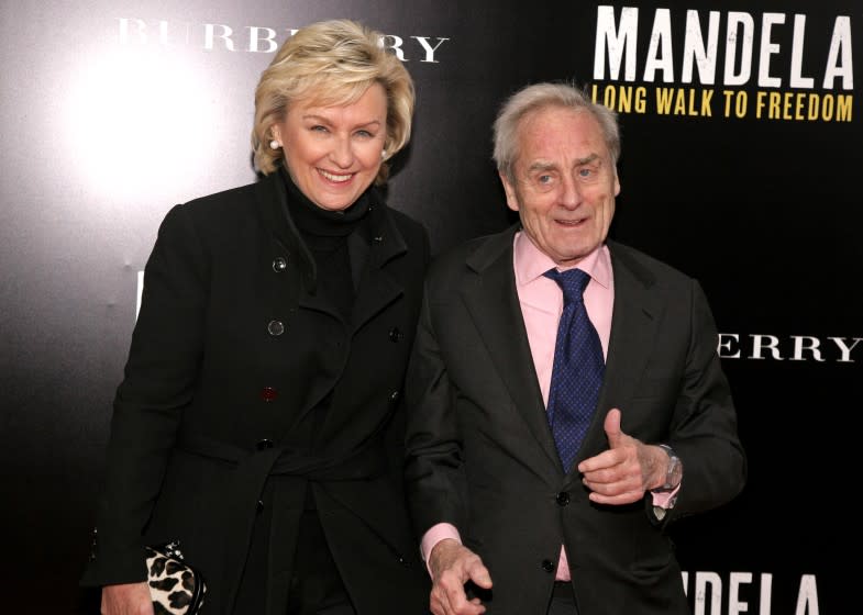 Journalist Tina Brown, left, and her husband, writer Harold Evans, right, attend a screening of "Mandela: Long Walk To Freedom" hosted by U2 and Anna Wintour on Monday, Nov., 25, 2013 in New York. (Photo by Andy Kropa/Invision/AP)