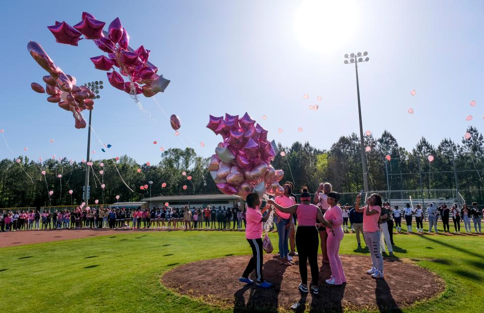 Students at Paul Bryant High gather and release balloons in memory of their classmate, Madison Sims, who was killed in a car wreck. 