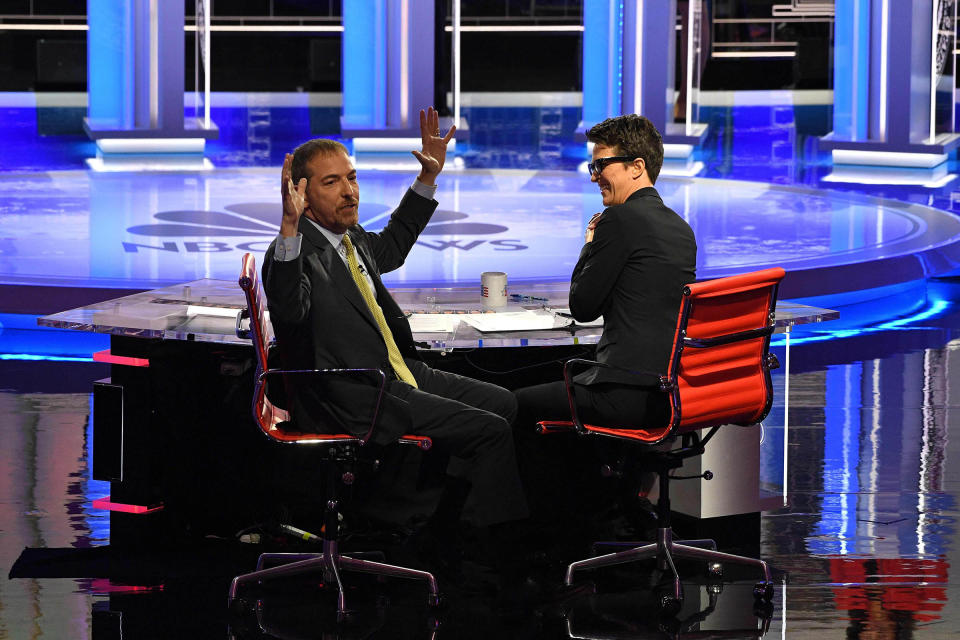 Moderators Chuck Todd (L) speaks to audience during a technical problem alongside Rachel Maddow as they host the first night of the Democratic presidential primary debate hosted by NBC News at the Adrienne Arsht Center for the Performing Arts in Miami, Florida, on June 26, 2019. | Jim Watson—AFP/Getty Images