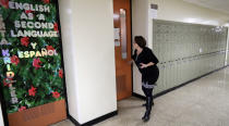 FILE - Boardman high school principal Cynthia Fernback checks classroom doors to make sure they are locked during a lockdown drill, on Feb. 14, 2019, in Boardman, Ohio. Since 2012, a total of 73 students have been killed in school shootings with at least four victims shot and two victims killed, according to research by James Alan Fox, a criminologist at Northeastern University who studies mass killings. (AP Photo/Tony Dejak, File)