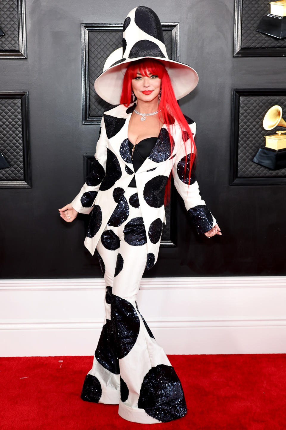 <p>The five-time Grammy winner wore a <a href="https://people.com/style/grammys-2023-shania-twain-red-carpet-photos/" rel="nofollow noopener" target="_blank" data-ylk="slk:black-and-white;elm:context_link;itc:0;sec:content-canvas" class="link ">black-and-white</a> Harris Reed suit with a head-turning hat. </p>