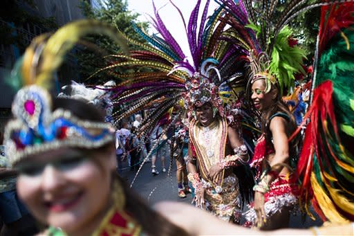 A young dancer waits for the start of her dance group at the annual Carnival of Cultures parade in Berlin, Sunday, May 27, 2012. Thousands of people attended the festival with costumes from all over the world. (AP Photo/Markus Schreiber)