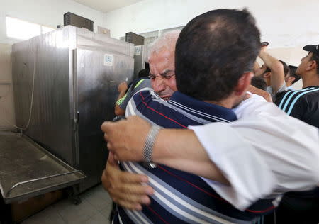 A relative of Palestinians, who were killed an explosion, mourns at a hospital morgue in Rafah in the southern Gaza Strip August 6, 2015. REUTERS/Ibraheem Abu Mustafa