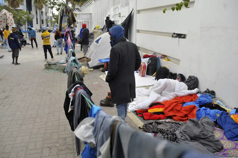 Sub-saharan migrants camp in front of the International Organization for Migration office as they seeks shelter and protection amidst attacks on them, in Tunis, Tunisia, Thursday, March 2, 2023. (AP Photo/Hassene Dridi)