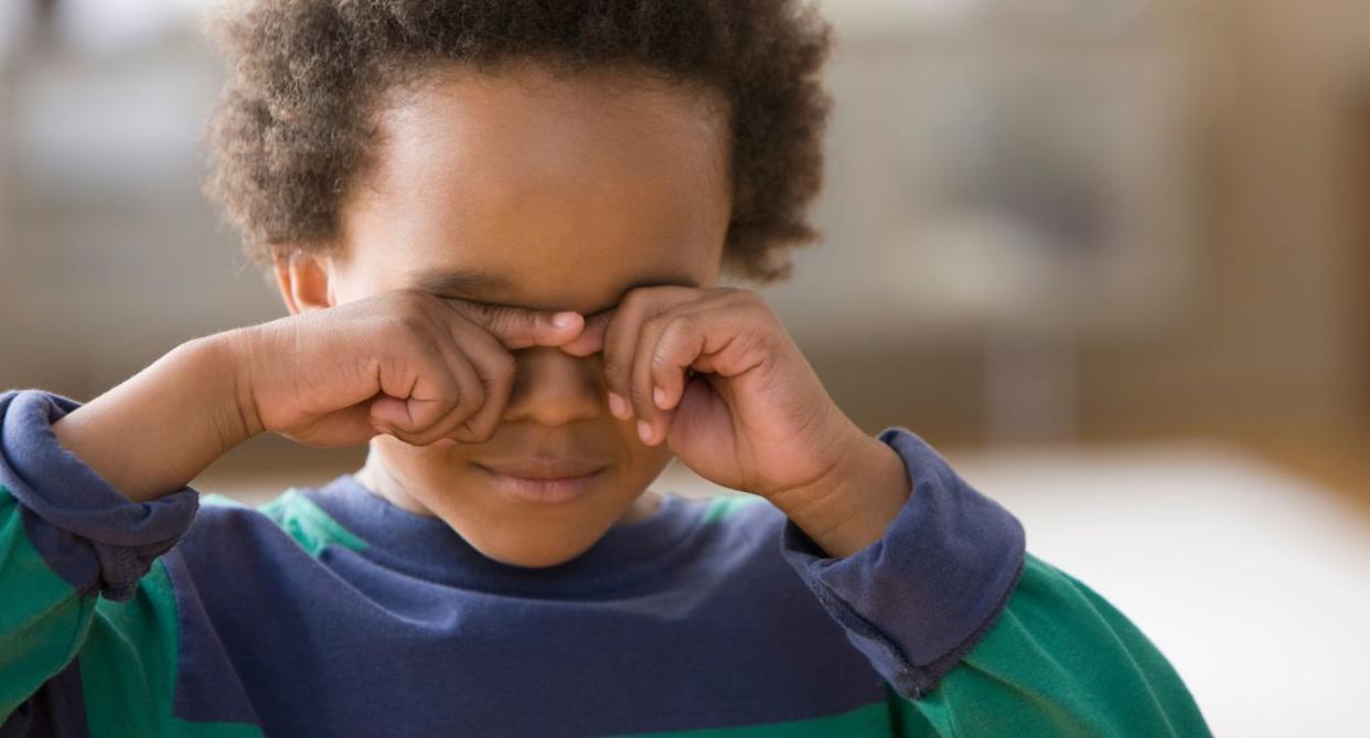 Child boy rubbing his eyes. (Getty Images)