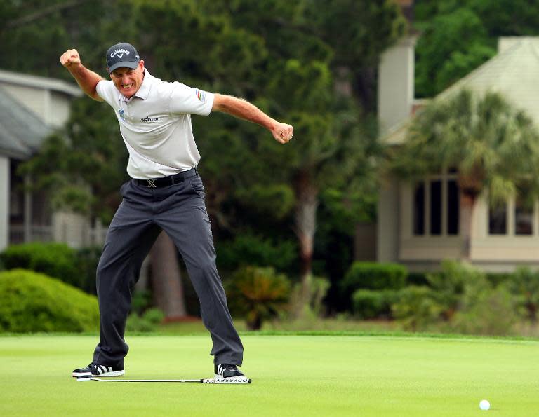 Jim Furyk makes a birdie putt on the second playoff hole against Kevin Kisner to win the RBC Heritage on April 19, 2015