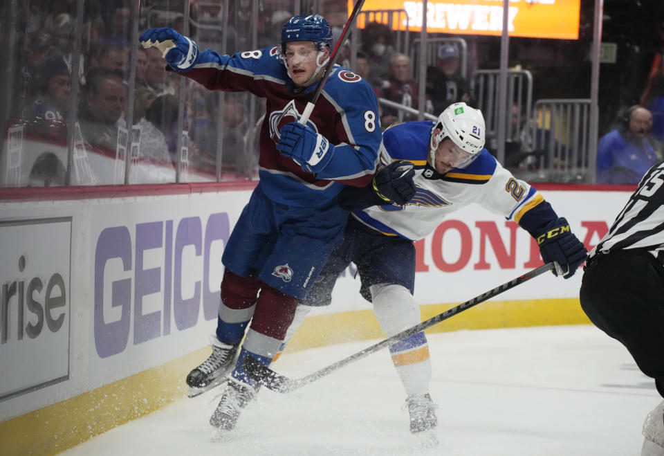 St. Louis Blues center Tyler Bozak, right, checks Colorado Avalanche defenseman Cale Makar during the second period of Game 5 of an NHL hockey Stanley Cup second-round playoff series Wednesday, May 25, 2022, in Denver. (AP Photo/David Zalubowski)